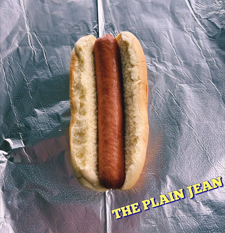 A plain dirty dog in a soft bun with nothing on it