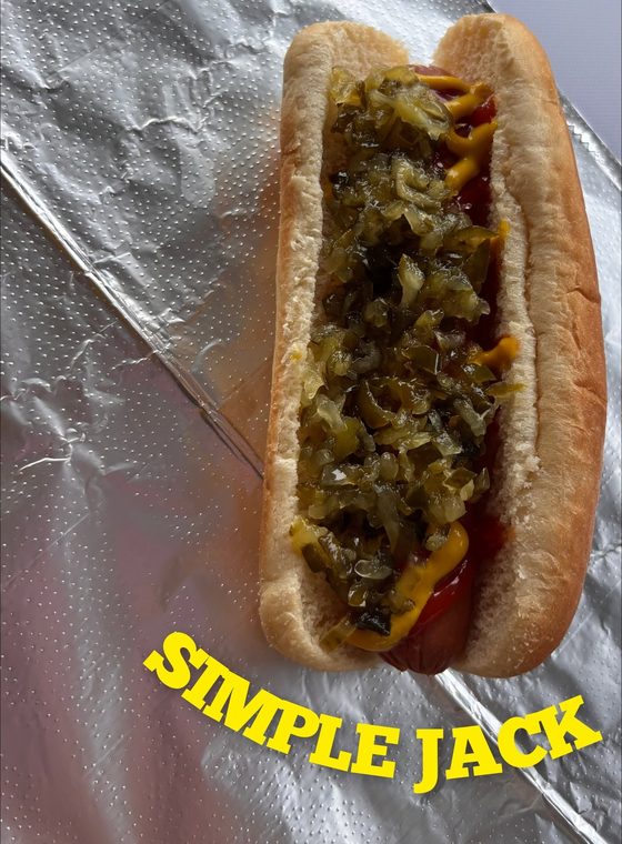 Simple Jack dirty dog with ketchup, yellow mustard and a heap of relish